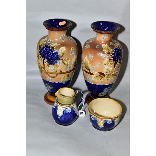 583 - A PAIR OF ROYAL DOULTON, DOULTON AND SLATTERS PATENT BALUSTER VASES, the buff textured ground tube l... 