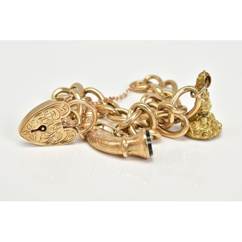 59 - A 9CT GOLD CHARM BRACELET, the charm bracelet which suspends two charms, the first a fob seal engrav... 