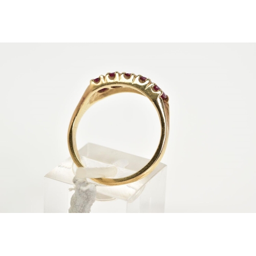 66 - A 9CT GOLD RUBY RING, designed with five oval cut claw set rubies, to a plain polished band, hallmar... 