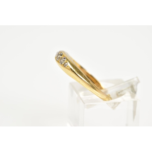 67 - A YELLOW METAL DIAMOND BOAT RING, designed with five graduated diamonds with a central round brillia... 