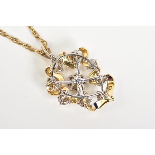 71 - A YELLOW METAL DIAMOND PENDANT NECKLACE, the yellow metal openwork scroll detail pendant set with ni... 