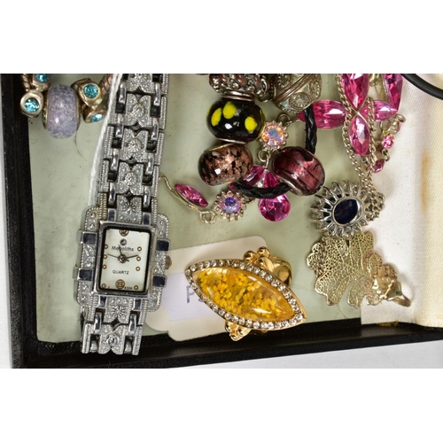 74 - A SELECTION OF COSTUME JEWELLERY, to include two white metal charm bracelets with charms, a pink cor... 