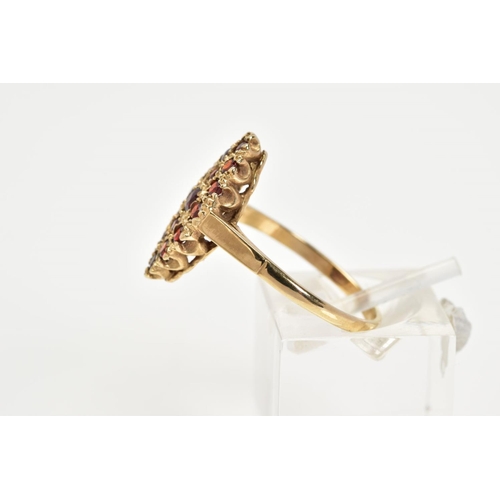 8 - A 9CT GOLD GARNET RING, of lozenge set with fifteen circular cut garnets, to the plain polished band... 