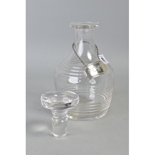 81 - A GLASS DECANTER AND SILVER LABEL, glass decanter with stopper, height approximately 22cm, together ... 