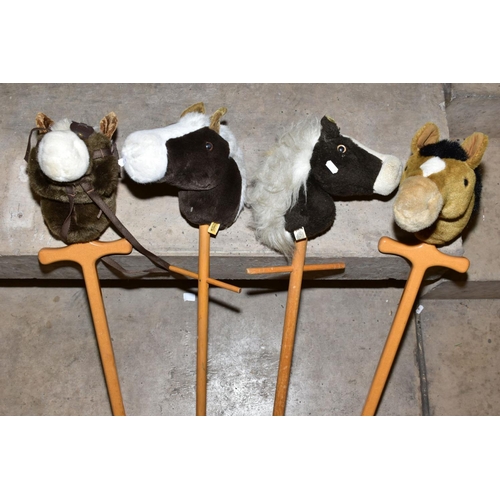 390 - FOUR MERRYTHOUGHT HOBBY HORSES, all appear complete and in fairly good condition, some marking and w... 