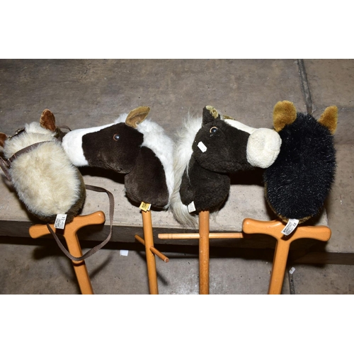 390 - FOUR MERRYTHOUGHT HOBBY HORSES, all appear complete and in fairly good condition, some marking and w... 