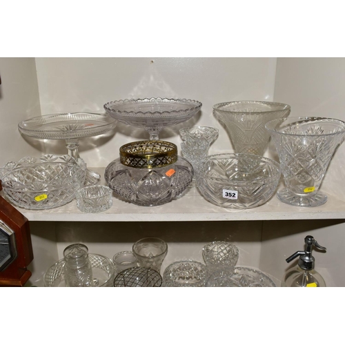 352 - A MISCELLANEOUS COLLECTION OF GLASSWARE, mostly cut glass including bowls, decanters, biscuit barrel... 