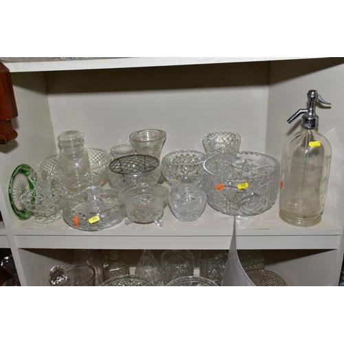 352 - A MISCELLANEOUS COLLECTION OF GLASSWARE, mostly cut glass including bowls, decanters, biscuit barrel... 