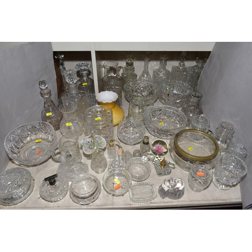 352 - A MISCELLANEOUS COLLECTION OF GLASSWARE, mostly cut glass including bowls, decanters, biscuit barrel... 