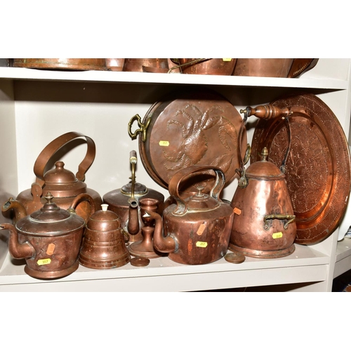 357 - A COLLECTION OF COPPER WARE, including moulds, fish moulds, fruit moulds, colander, kettles, hot wat... 