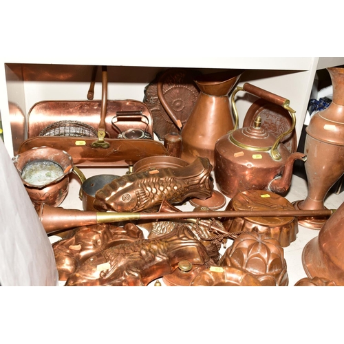 357 - A COLLECTION OF COPPER WARE, including moulds, fish moulds, fruit moulds, colander, kettles, hot wat... 