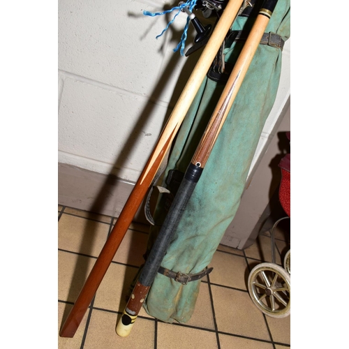 430 - TWO SNOOKER CUES AND A BAG OF FISHING RODS etc, including net, umbrella, five unbranded split canes ... 