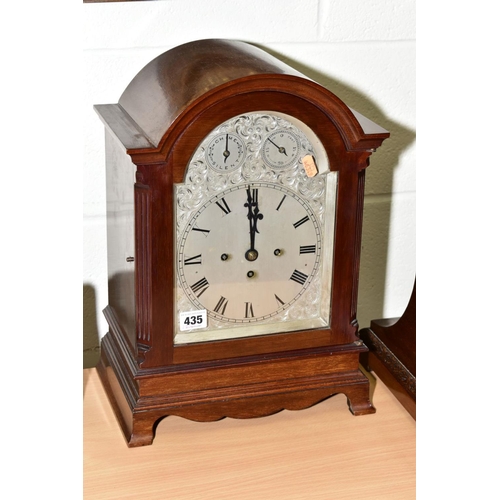 435 - AN EARLY 20TH CENTURY MAHOGANY CASED BRACKET CLOCK, arched top above a foliate engraved silvered dia... 