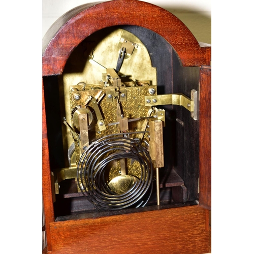 435 - AN EARLY 20TH CENTURY MAHOGANY CASED BRACKET CLOCK, arched top above a foliate engraved silvered dia... 