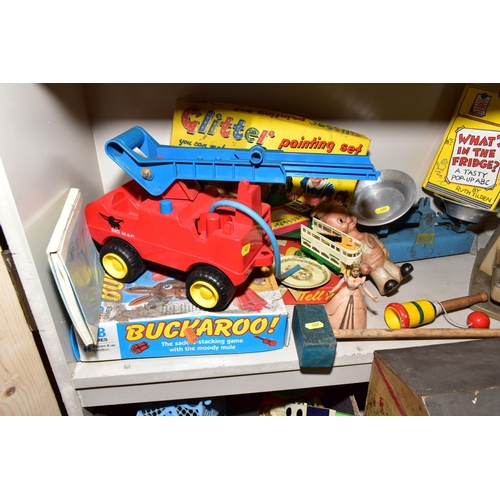 407 - A QUANTITY OF TOYS AND GAMES, including an Action man car, two boxes of Scalextrix track, a painted ... 