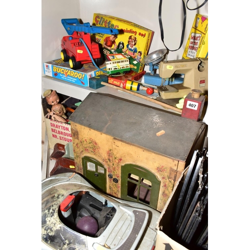 407 - A QUANTITY OF TOYS AND GAMES, including an Action man car, two boxes of Scalextrix track, a painted ... 