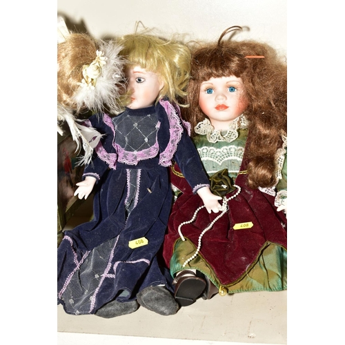 408 - A GROUP OF COLLECTOR'S DOLLS, TWO REPRODUCTION DOLL'S PRAMS ETC, including a painted wooden book tro... 