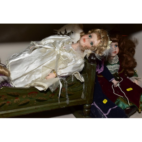 408 - A GROUP OF COLLECTOR'S DOLLS, TWO REPRODUCTION DOLL'S PRAMS ETC, including a painted wooden book tro... 