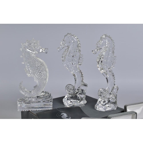 471 - A GROUP OF WATERFORD CRYSTAL SEAHORSES, comprising two boxed 'Seahorse Momento' height 6.5cm, an emp... 