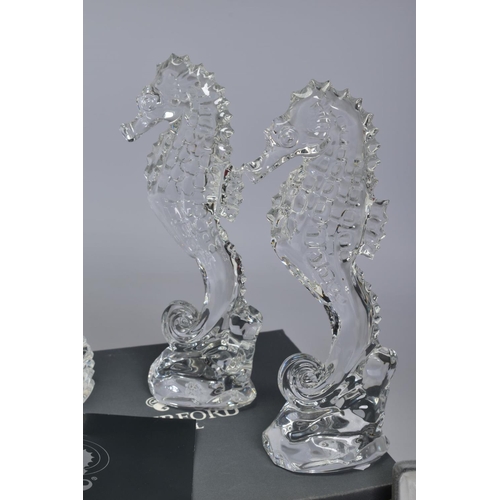 471 - A GROUP OF WATERFORD CRYSTAL SEAHORSES, comprising two boxed 'Seahorse Momento' height 6.5cm, an emp... 