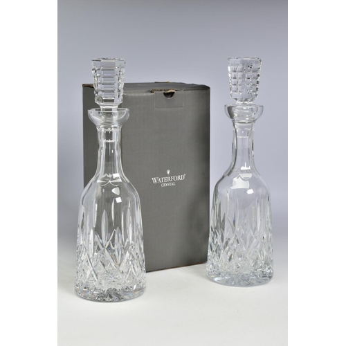 478 - A PAIR OF WATERFORD CRYSTAL LISMORE WINE DECANTERS, one boxed, stamped to side, height with stopper ... 