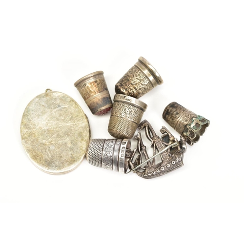 49 - A SELECTION OF ITEMS, to include three silver thimbles, with Chester and Birmingham hallmarks, two o... 