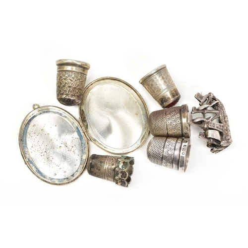 49 - A SELECTION OF ITEMS, to include three silver thimbles, with Chester and Birmingham hallmarks, two o... 