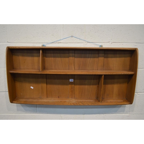 1298 - AN ERCOL GOLDEN DAWN ELM HANGING PLATE RACK, width 107cm x depth 12cm x height 50cm