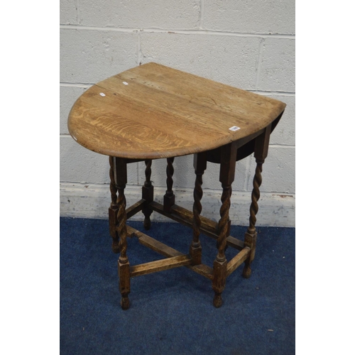 1300 - A SMALL EARLY 20TH CENTURY OAK OVAL TOPPED BARLEY TWIST GATE LEG TABLE