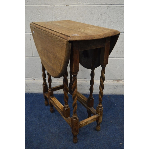 1300 - A SMALL EARLY 20TH CENTURY OAK OVAL TOPPED BARLEY TWIST GATE LEG TABLE