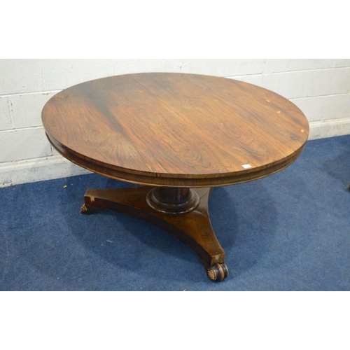 1333 - A VICTORIAN ROSEWOOD CIRCULAR TILT TOP BREAKFAST TABLE, on a cylindrical tapering support, concave t... 