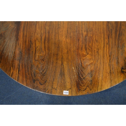 1333 - A VICTORIAN ROSEWOOD CIRCULAR TILT TOP BREAKFAST TABLE, on a cylindrical tapering support, concave t... 