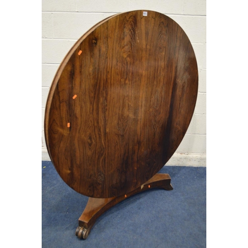 1333 - A VICTORIAN ROSEWOOD CIRCULAR TILT TOP BREAKFAST TABLE, on a cylindrical tapering support, concave t... 