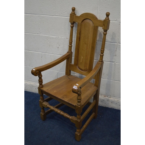 1338 - A REPRODUCTION GOLDEN OAK OPEN ARMCHAIR