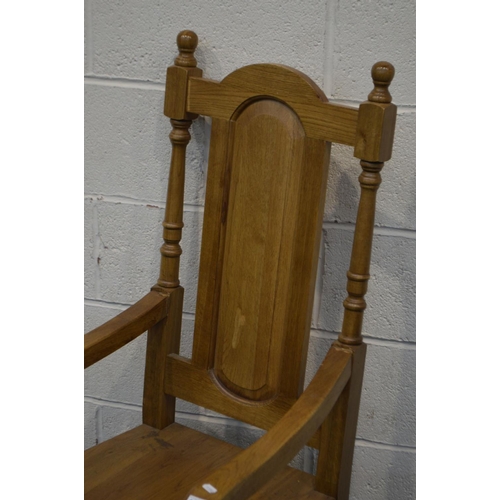 1338 - A REPRODUCTION GOLDEN OAK OPEN ARMCHAIR