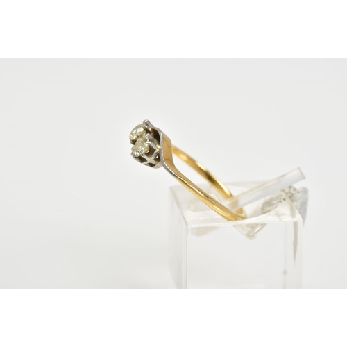 4 - A YELLOW METAL DIAMOND RING, of crossover design set with two round brilliant cut diamonds, total es... 