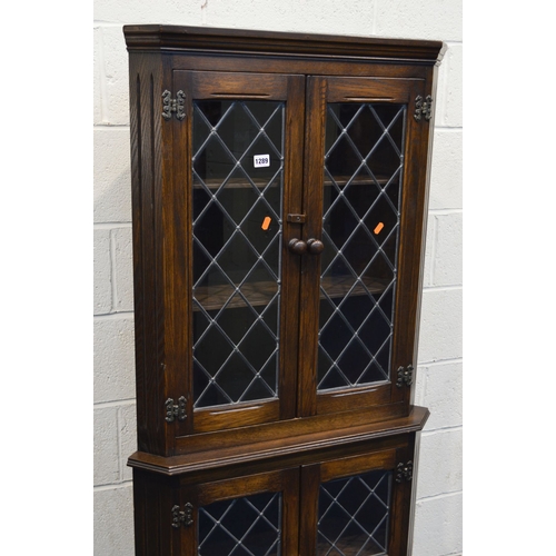 1317 - A MODERN LEAD GLAZED FOUR DOOR CORNER CUPBOARD