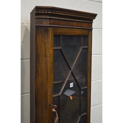 1319 - A REPRODUCTION MAHOGANY GLAZED SINGLE DOOR CORNER CUPBOARD (key) together with a modern grey foliate... 