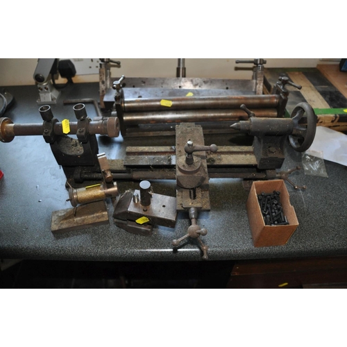 103 - A SMALL SHEET METAL BENDER, 39cm wide, a small sheet metal roller 35cm wide, a small lathe 55cm tota... 