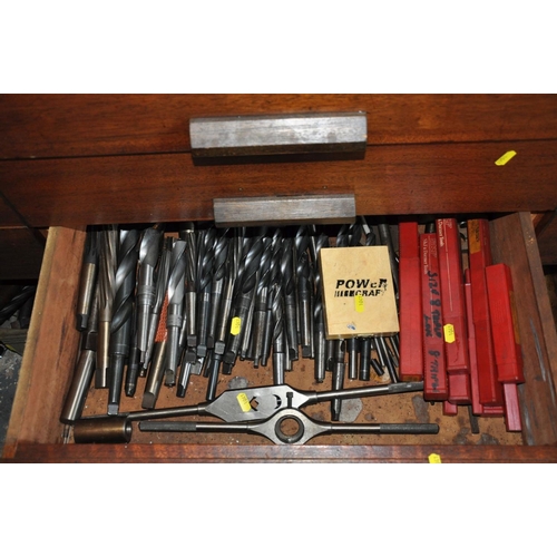 106 - THE CONTENTS OF TWO DRAWERS, containing a large quantity of Taper shank and normal drill, taps, dies... 