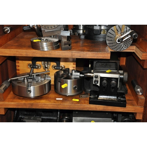 125 - A WOODEN CABINET CONTAINING, Milling machine and Lathe parts including Rotary tables, dividing Heads... 