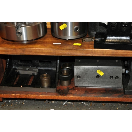 125 - A WOODEN CABINET CONTAINING, Milling machine and Lathe parts including Rotary tables, dividing Heads... 