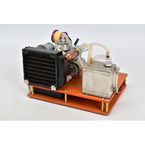 26 - A NIKKO VERTICAL SINGLE CYLINDER WATER COOLED ENGINE, with radiator, fan, circulating pump and dynam... 