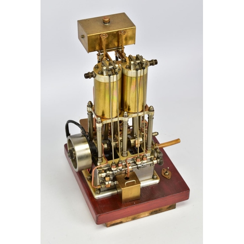 43 - A HANDBUILT MODEL VERTICAL TWIN CYLINDER MARINE ENGINE, not tested, spirit or gas fired, fitted spar... 