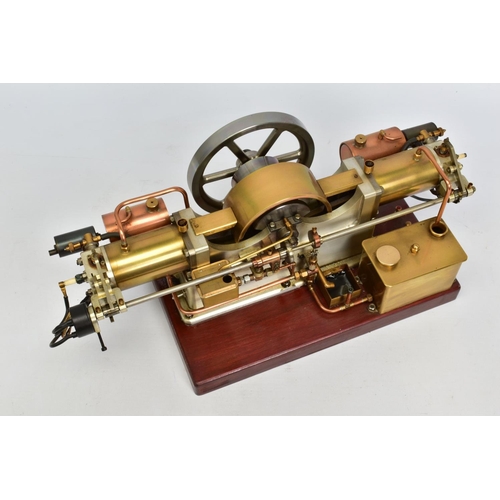 45 - A HANDBUILT MODEL HORIZONTAL TWIN CYLINDER STATIONARY ENGINE, cylinder flanking central flywheel (di... 