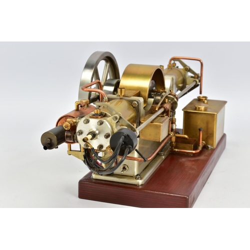 45 - A HANDBUILT MODEL HORIZONTAL TWIN CYLINDER STATIONARY ENGINE, cylinder flanking central flywheel (di... 