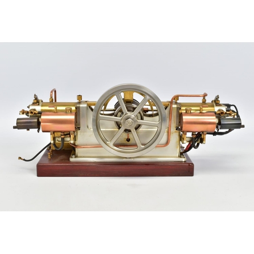 45 - A HANDBUILT MODEL HORIZONTAL TWIN CYLINDER STATIONARY ENGINE, cylinder flanking central flywheel (di... 