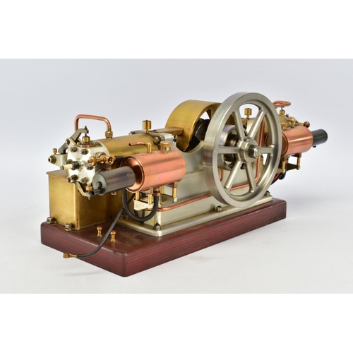 45 - A HANDBUILT MODEL HORIZONTAL TWIN CYLINDER STATIONARY ENGINE, cylinder flanking central flywheel (di... 