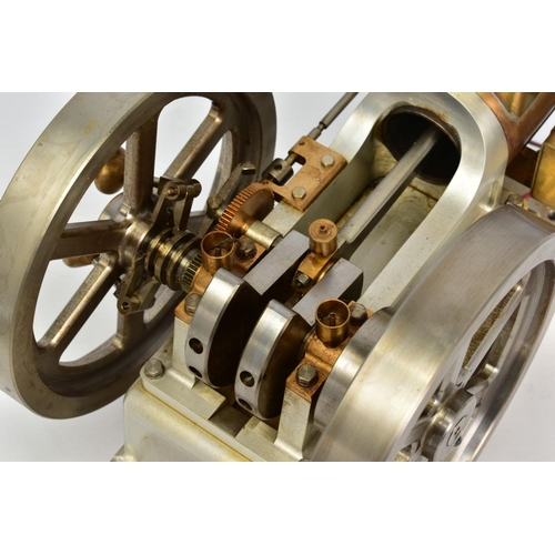 46 - A HANDBUILT MODEL HORIZONTAL SINGLE CYLINDER STATIONARY ENGINE, powering twin flywheels (diameter ap... 