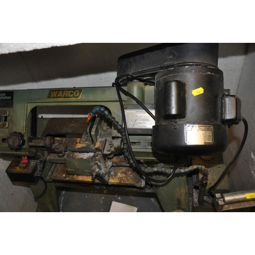 77 - A WARCO 4 1/2'' METAL CUTTING BAND SAW, on stand with a homemade roller stand (2)